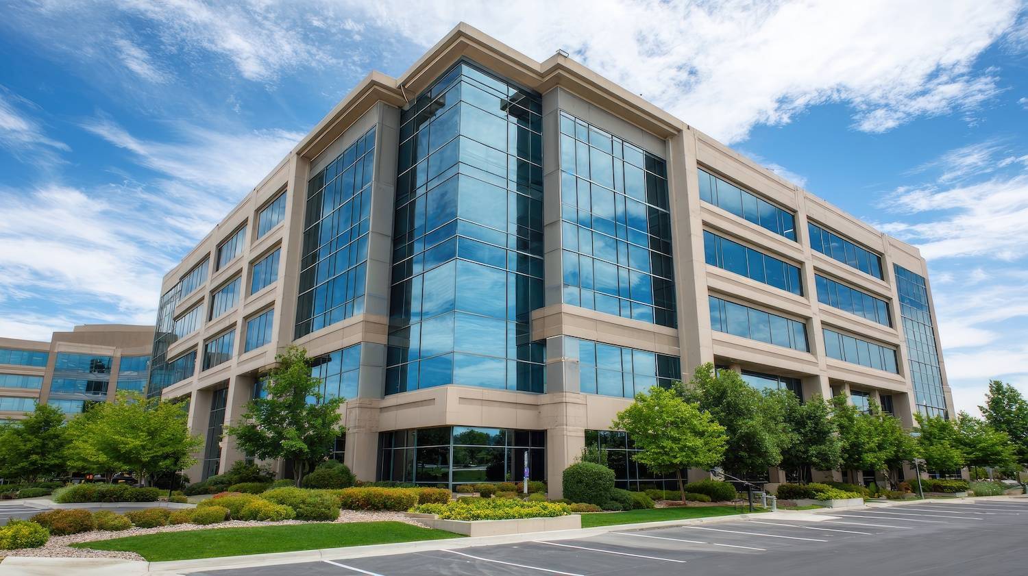 A commercial office building with beautiful landscaping and plantings