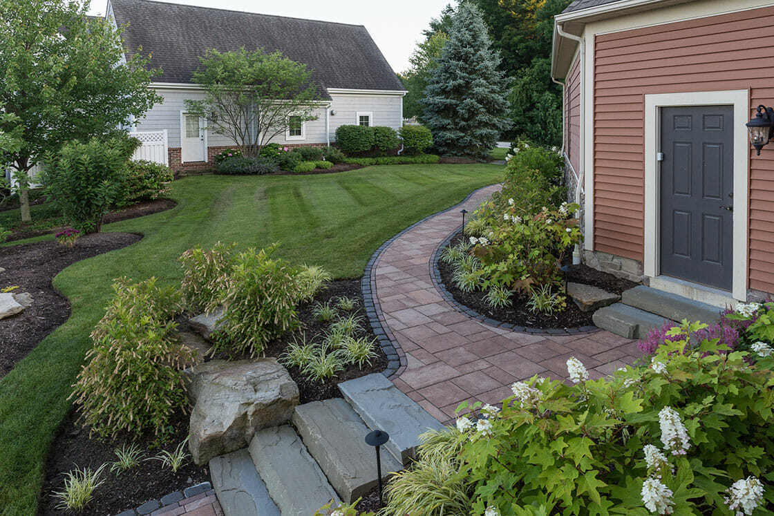 Expertly crafted stone walkways and patios complementing a lakeside home in Cleveland, OH-1